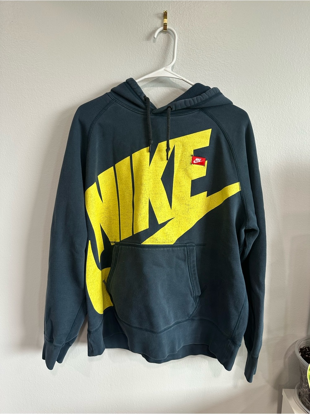 Vintage Nike Men's Navy Hoodie with Bold Yellow Swoosh Graphic